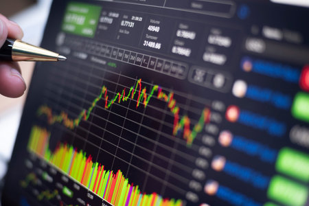 Stock Market monitor screen closeup on tablet with analysis while open market for trading sell and...