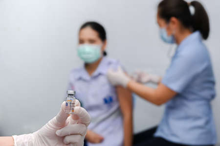 Thailand - April 9 , 2021 Close up of Sinovac Vaccine vials bottles for can help stop pandemic ,COVID-19 vaccines can help reduce the transmission of the new coronavirus from person to personのeditorial素材
