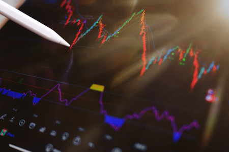closeup man analysis stock chart for investment trading on screen and analysis graph. Business...