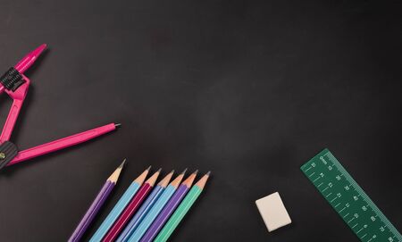 Abstract education concept, Above view school stationery equipment and Teaching equipment on chalkboard, copy space used for additional messages.の写真素材