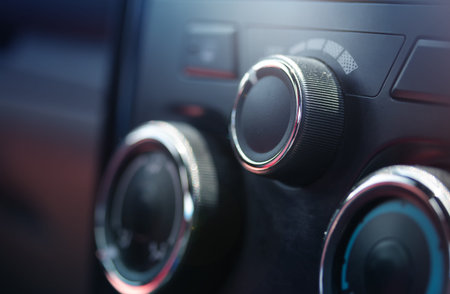 Air conditioning control panel set inside the car cabin.