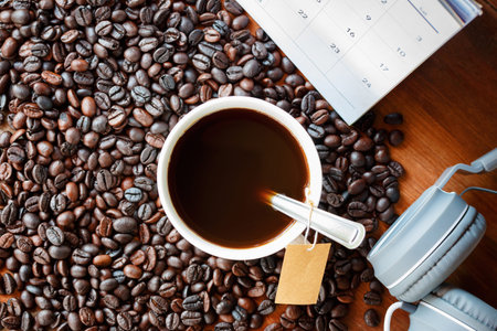 Abstract music and black coffee vintage style concept. Luxuriousness and relaxation of black coffee and coffee beans roasted interweave of music concept and happiness every day with calendar backdrop.の写真素材