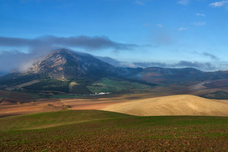 Sierra de PeÃ±arrubia with clouds in the Guadalteba region in Malaga. AndalacÃ­a, Spain