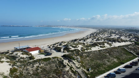 DCIM\108MEDIA\DJI_0737.JPGBeautiful beach with sand dunes in Peniche, Portugalの写真素材