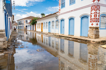 Tidal flooding creating mirror reflections on a colonial street in Paratyのeditorial素材