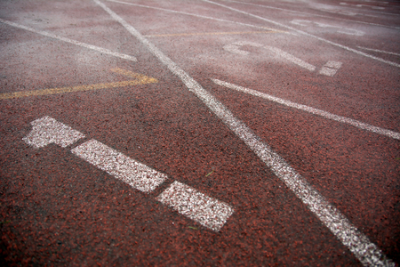 Photo of a covering of a racetrack for athletes with a marking and numbersの写真素材