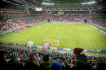 Blurred view from the stands on a football match at the big stadiumの写真素材