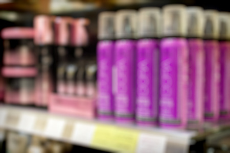 Blurred store shelf with cosmetic products for use as a backgroundの写真素材