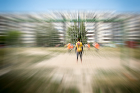 Abstract blurred teenagers play street football の写真素材