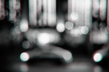 Black and white photo of the night city street lights bokeh backgroundの写真素材