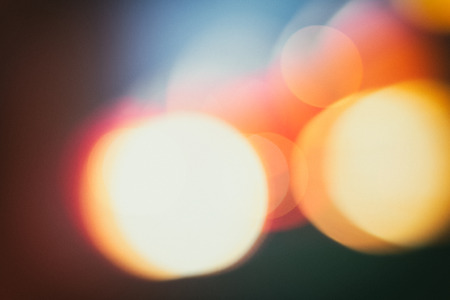 Multicolored defocused lights in the city at nightの写真素材