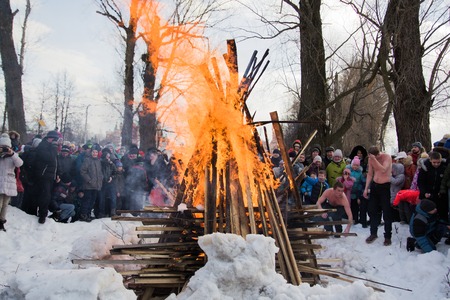 Yoshkar-Ola, Russia - February 26, 2017 Maslenitsa celebration. The ritual of burning the scarecrow of maslenitsa on the stage of the city parkのeditorial素材