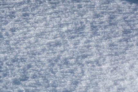 White snowflakes background, rough pattern of snow textureの写真素材