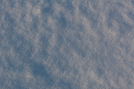 White snowflakes background, rough pattern of snow textureの写真素材