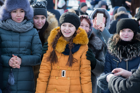 Yoshkar-Ola, Russia - February 19, Russia - Smiling viewers on the Maslenitsa holidayのeditorial素材