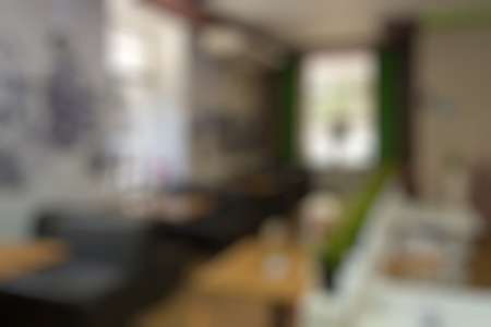 Coffee shop blur background with bokeh imageの写真素材