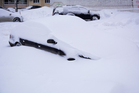 Snow covered the whole car with snowの写真素材