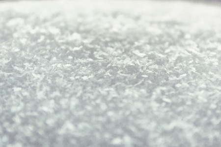 Macro image of snowflakes at sunset. Winter background. Selective focusの写真素材