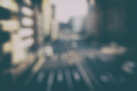 Blurred cityscape background scene. Retro background with stylized filmの写真素材