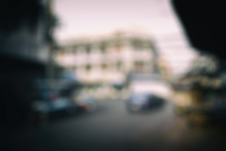 Blurred cityscape background scene. Retro background with stylized filmの写真素材