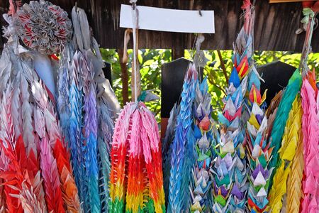 Thousand of Paper cranes hanging at Fushimi Inari taisha, a Shinto shrine of the kami Inari, located in Fushimi-ku, Kyoto, Japan.の写真素材