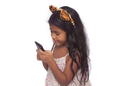 Beautiful girl using cellphone isolated on white.の写真素材