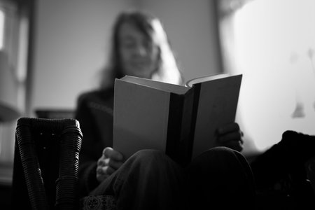 Elderly women reading a bookの写真素材