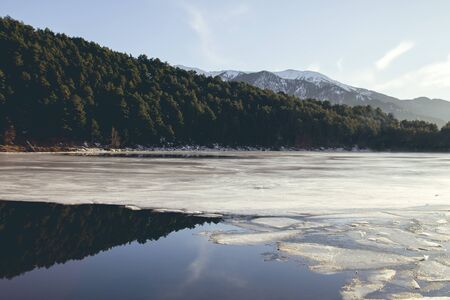 Frozen lake in the mountainsの写真素材