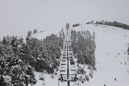 Wintry landscape with chairlifts in ski areaの写真素材