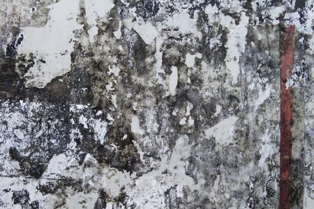 Old bulletin board with rests of paperの写真素材