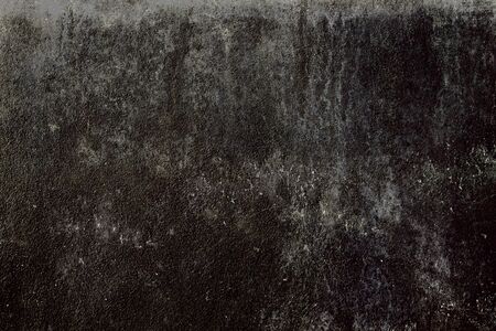 Black grungy wall backdrop or textureの写真素材