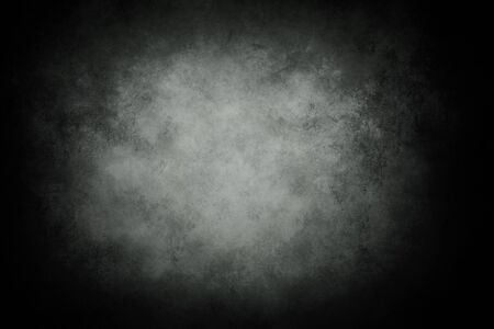 Gray grungy backdrop with dark vignette bordersの写真素材