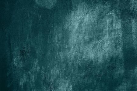 Dark green grungy canvas backdrop or textureの写真素材