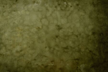 Grungy green backdrop with dark vignette bordersの写真素材