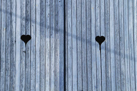 Blue wooden door gates with heartの写真素材