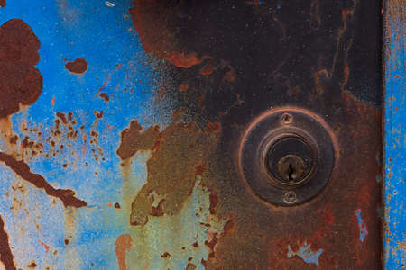 Old lock in a rusted doorの写真素材