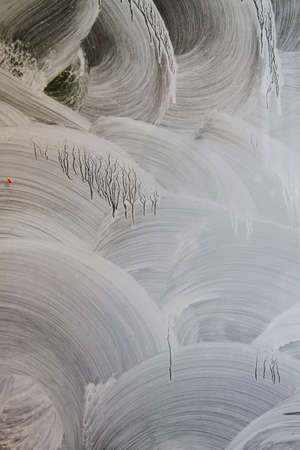 White paint strokes on a shop window glassの写真素材