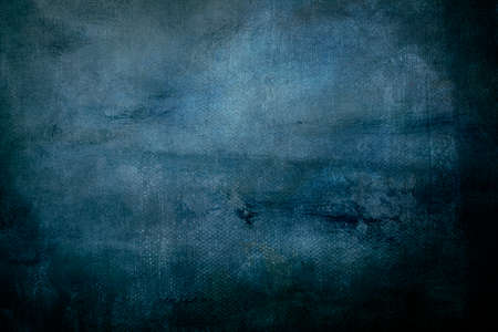 Grungy backdrop with dark vignette borders and texturesの写真素材