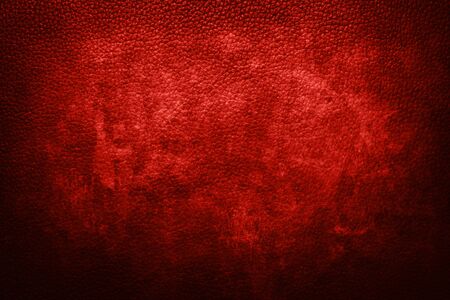 Old red leather texture with dark bordersの写真素材