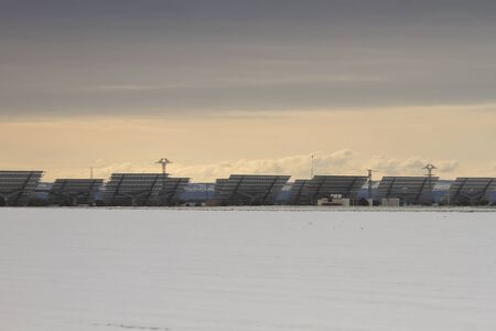 Solar panels farm in snowy landscapeの写真素材
