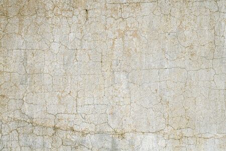 Old white cracked wall backdropの写真素材