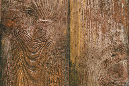 Old rustic wooden wall with peeling paintの写真素材