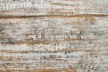 Old rustic wooden wall with peeling paintの写真素材