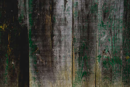 Old rustic wooden wall with peeling paintの写真素材