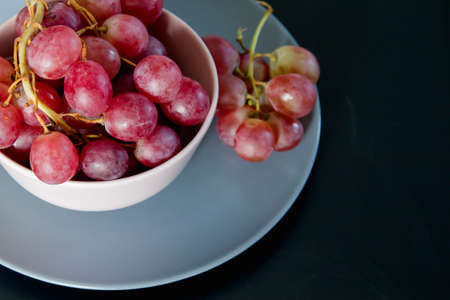 A bowl of fresh red grapesの写真素材