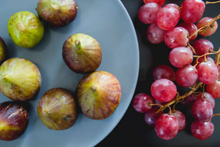 Fresh figs and red grapesの写真素材