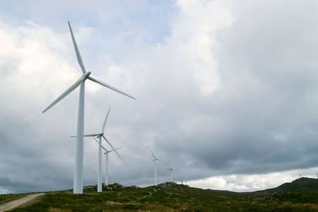Wind turbines generating clean renewable green energy, environmental concept, copy spaceの写真素材