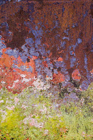 Old rusted wall with peeling paintの写真素材