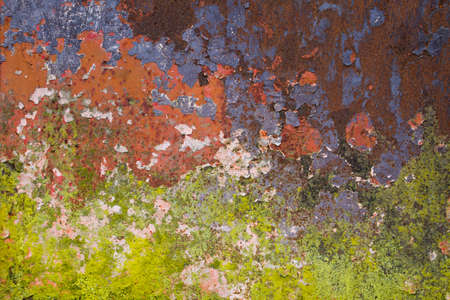 Old rusted wall with peeling paintの写真素材