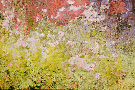 Old rusted wall with peeling paintの写真素材